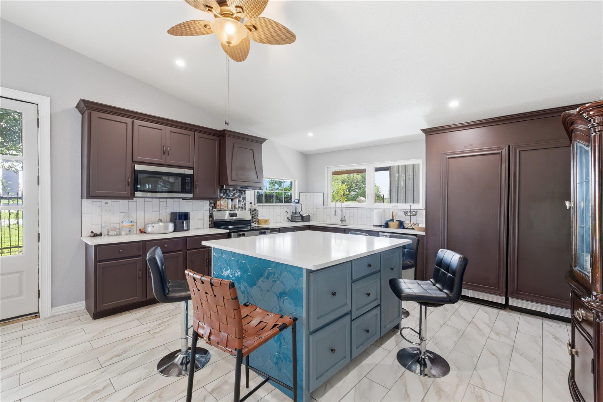 Spacious kitchen featuring a central island with 