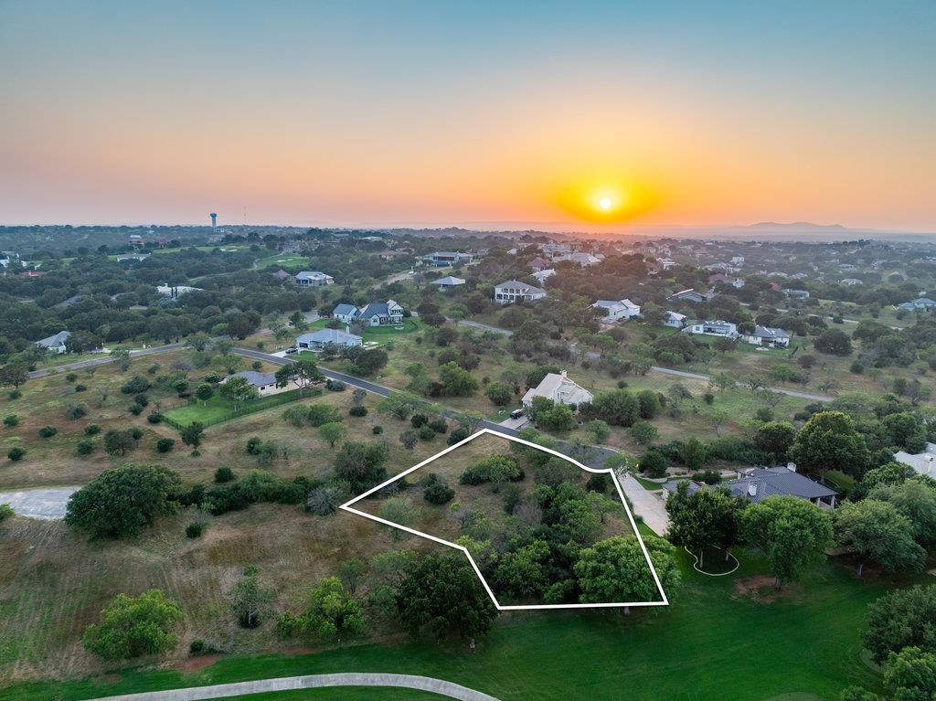 Aerial view at dusk of property parcel outlined a