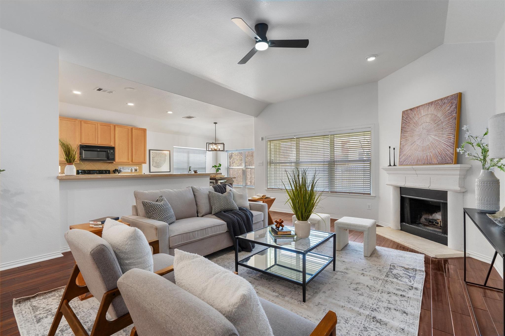 Living area featuring dark wood-style flooring, a