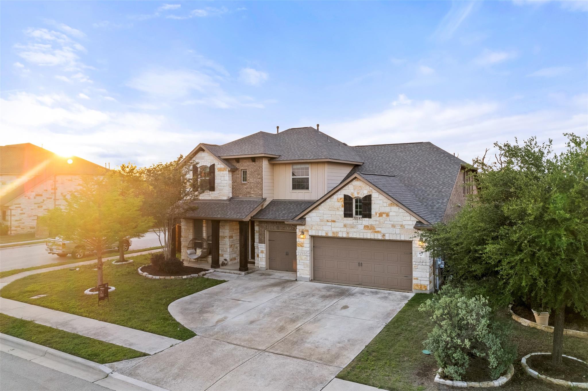 Exterior featuring stone and siding finishes, a t
