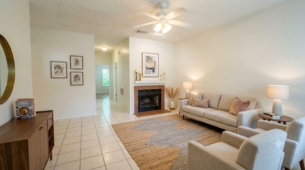 A comforting living area offers a brick fireplace