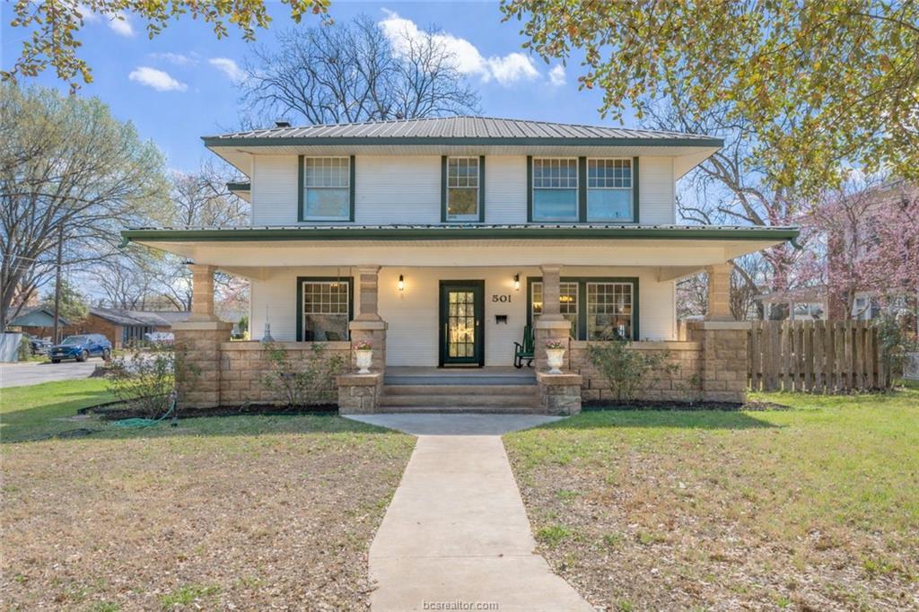 Traditional style home featuring a front lawn, co