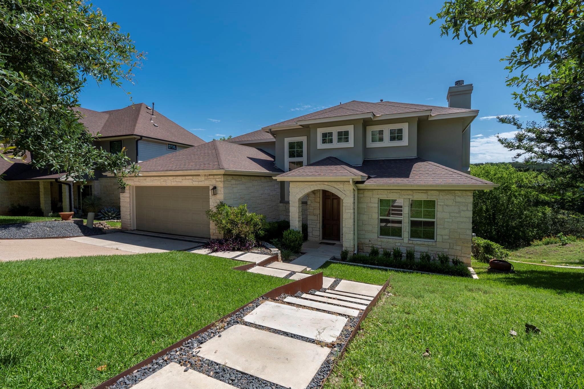 Stone and stucco exterior with multiple gables an