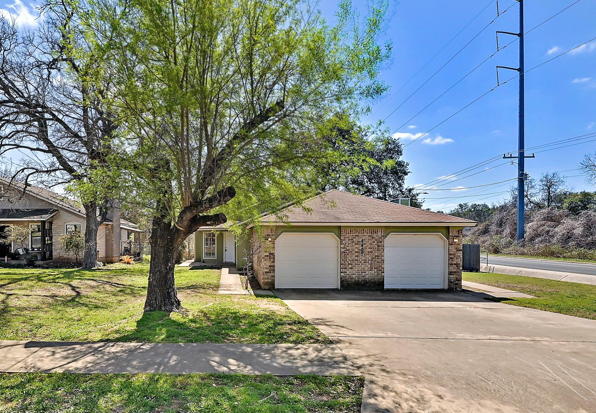 View of front of property featuring an attached g