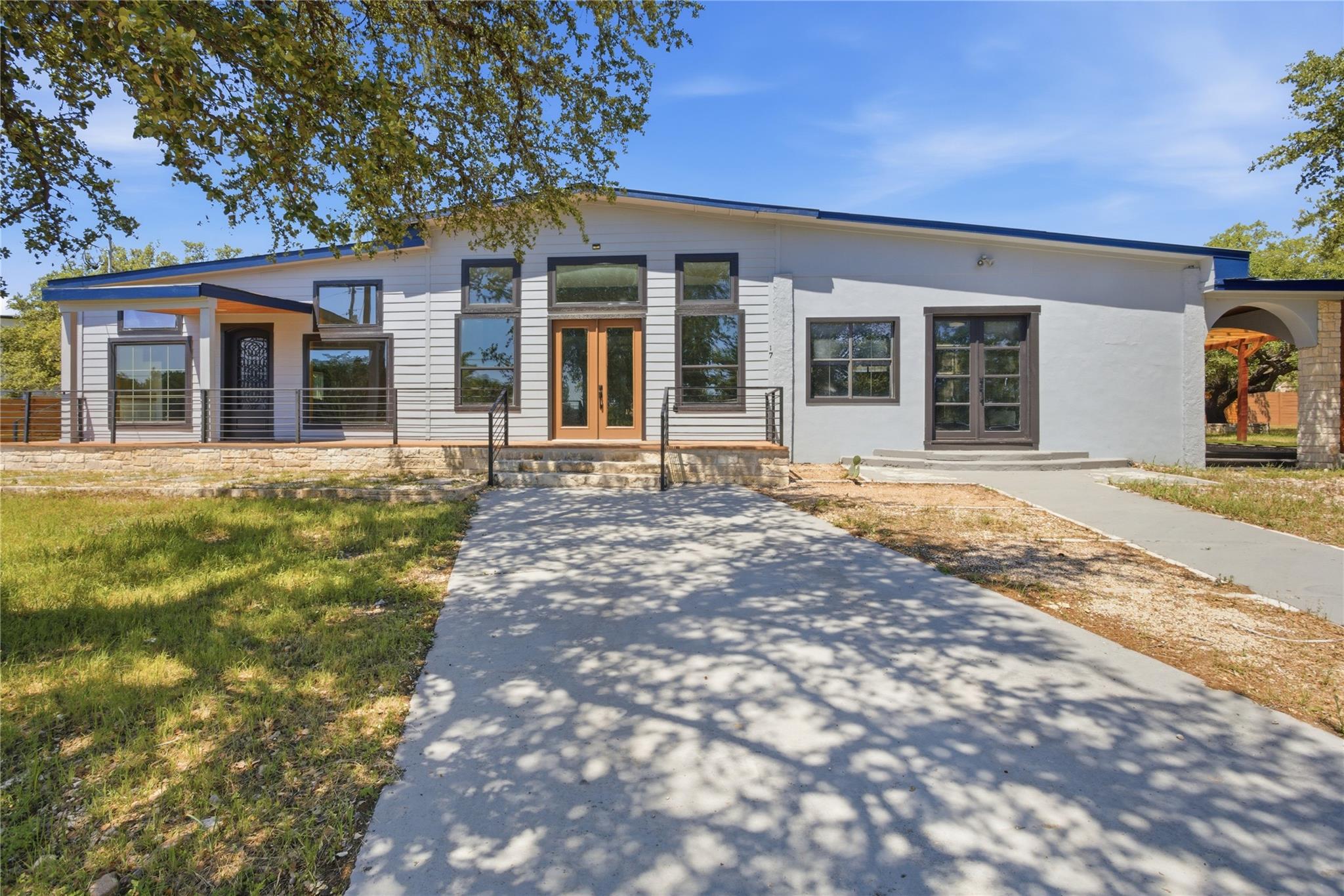A contemporary facade showcases expansive windows