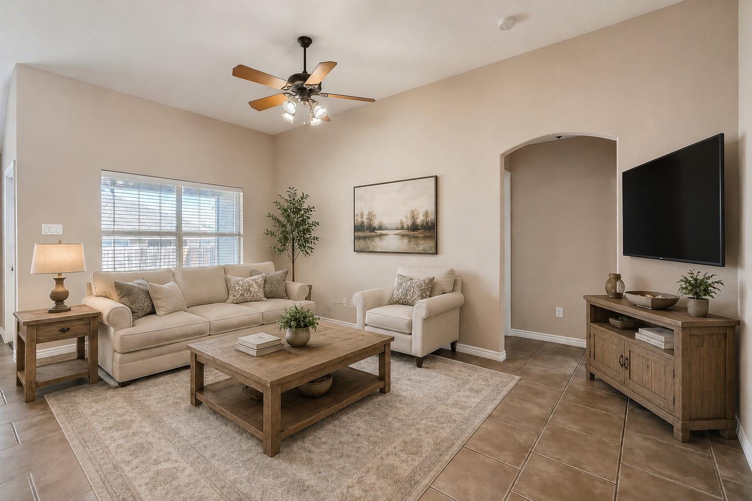 A comfortable living area features a broad window