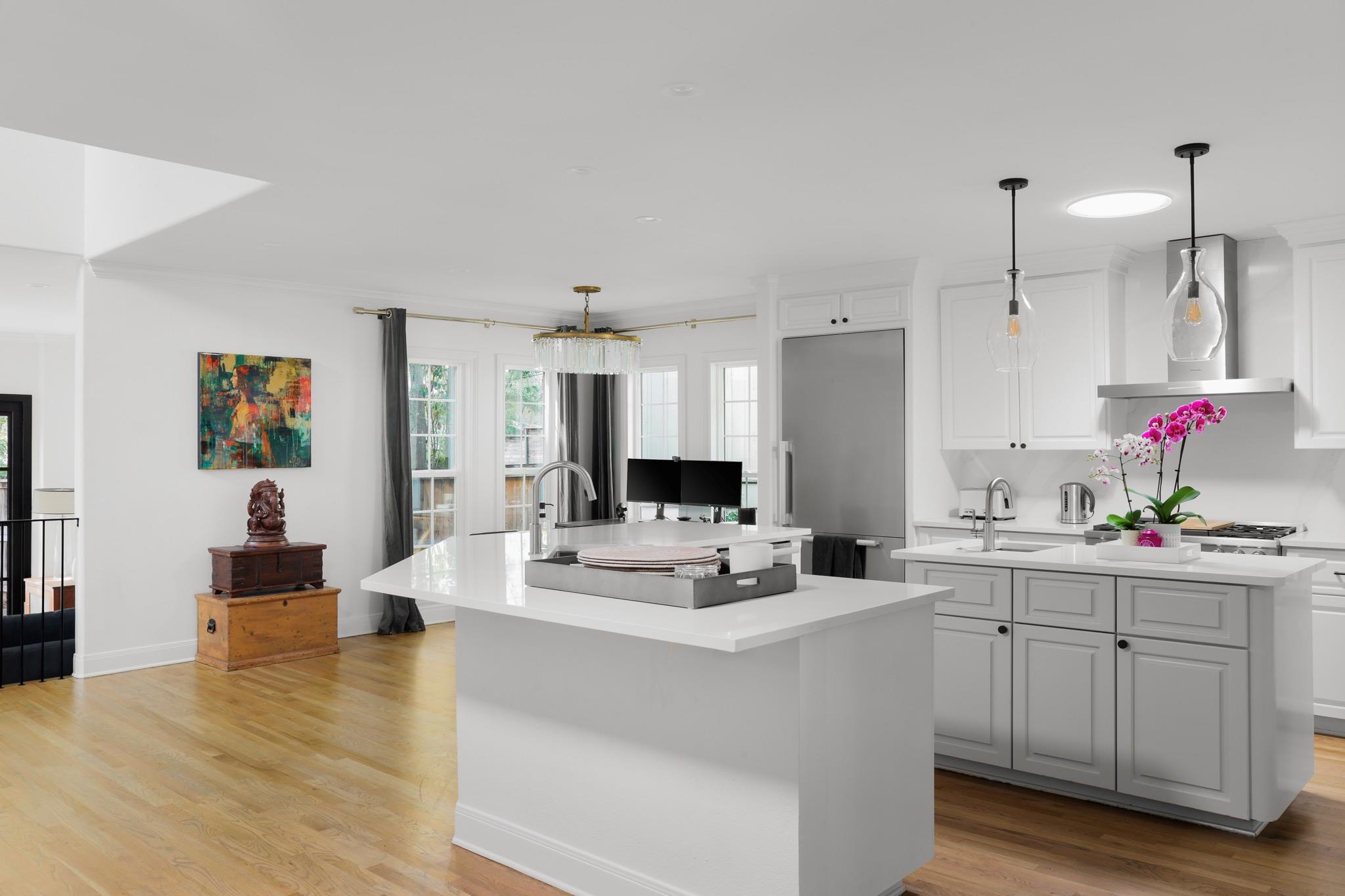 Kitchen featuring light wood-style floors, white 