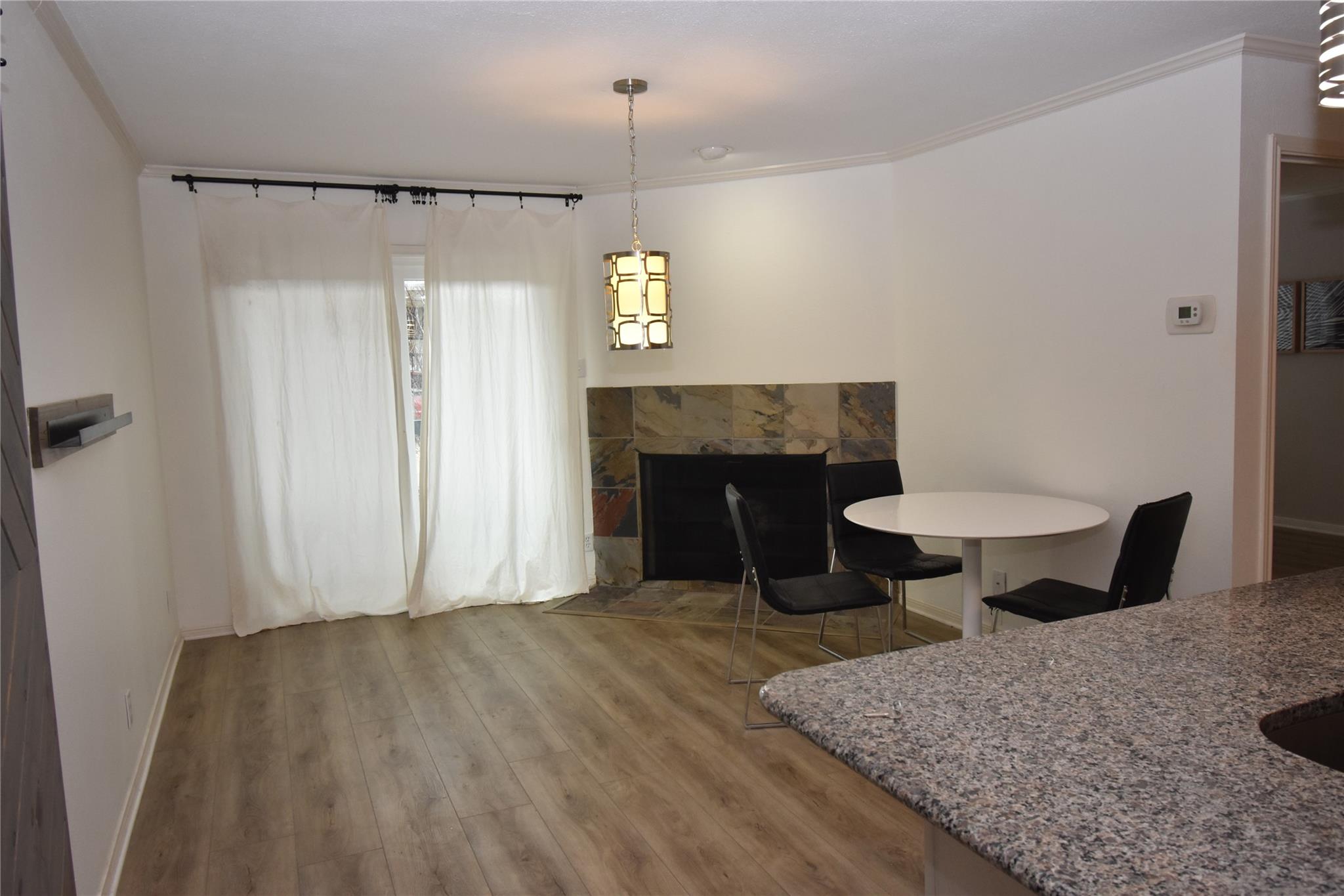 Dining room with wood finished floors, ornamental