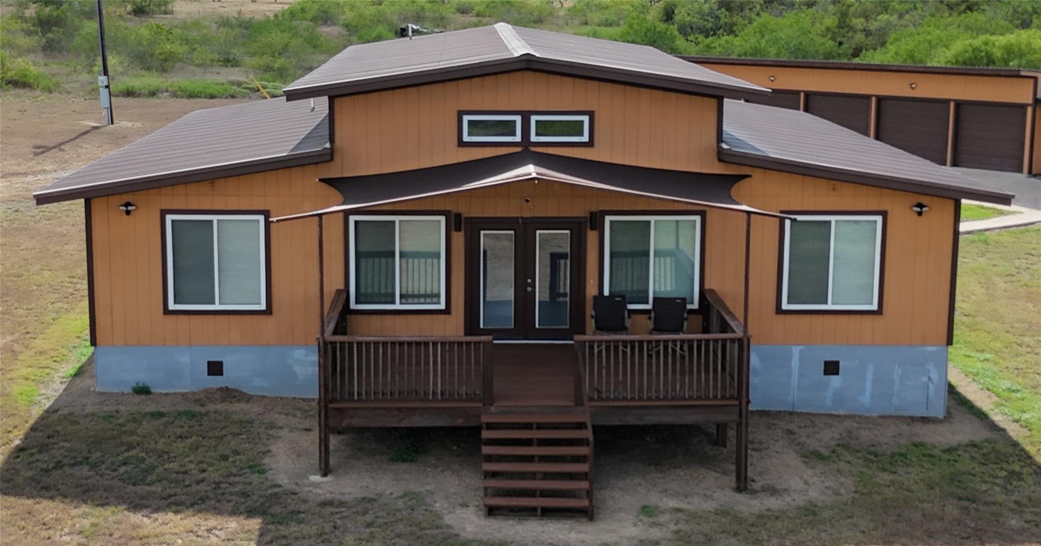 An elevated wooden deck welcomes visitors to this
