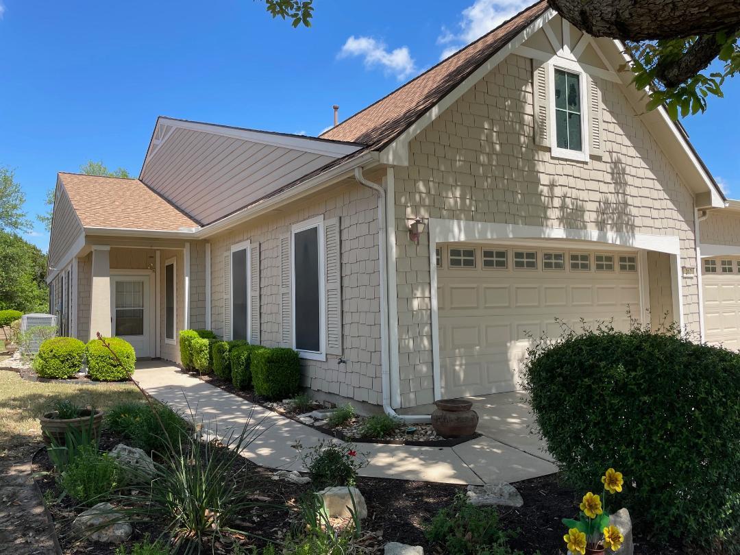View of side of home featuring an attached garage