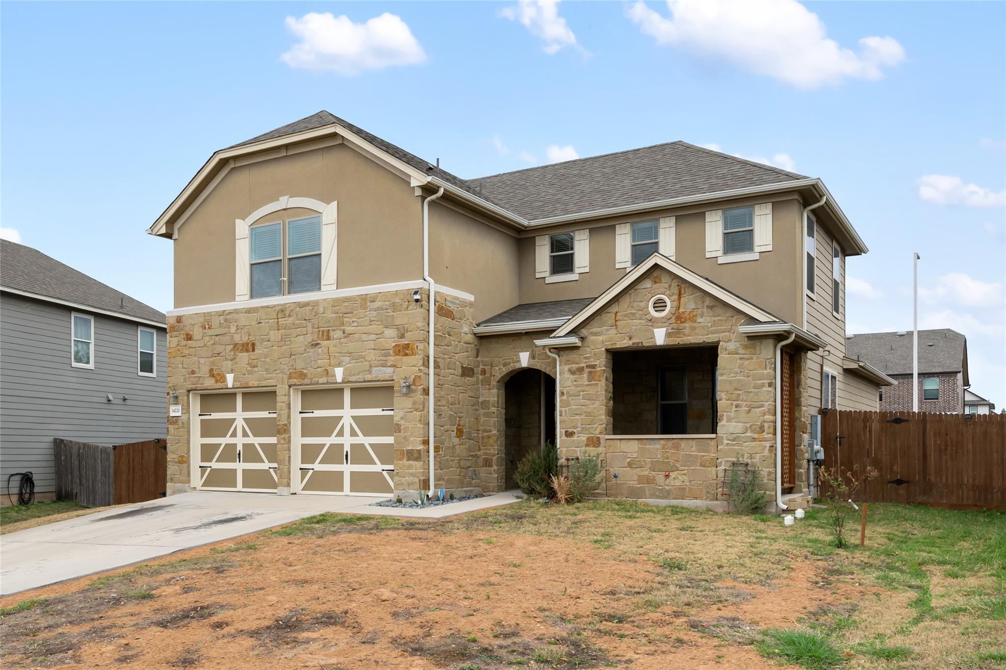 View of front facade featuring an attached garage