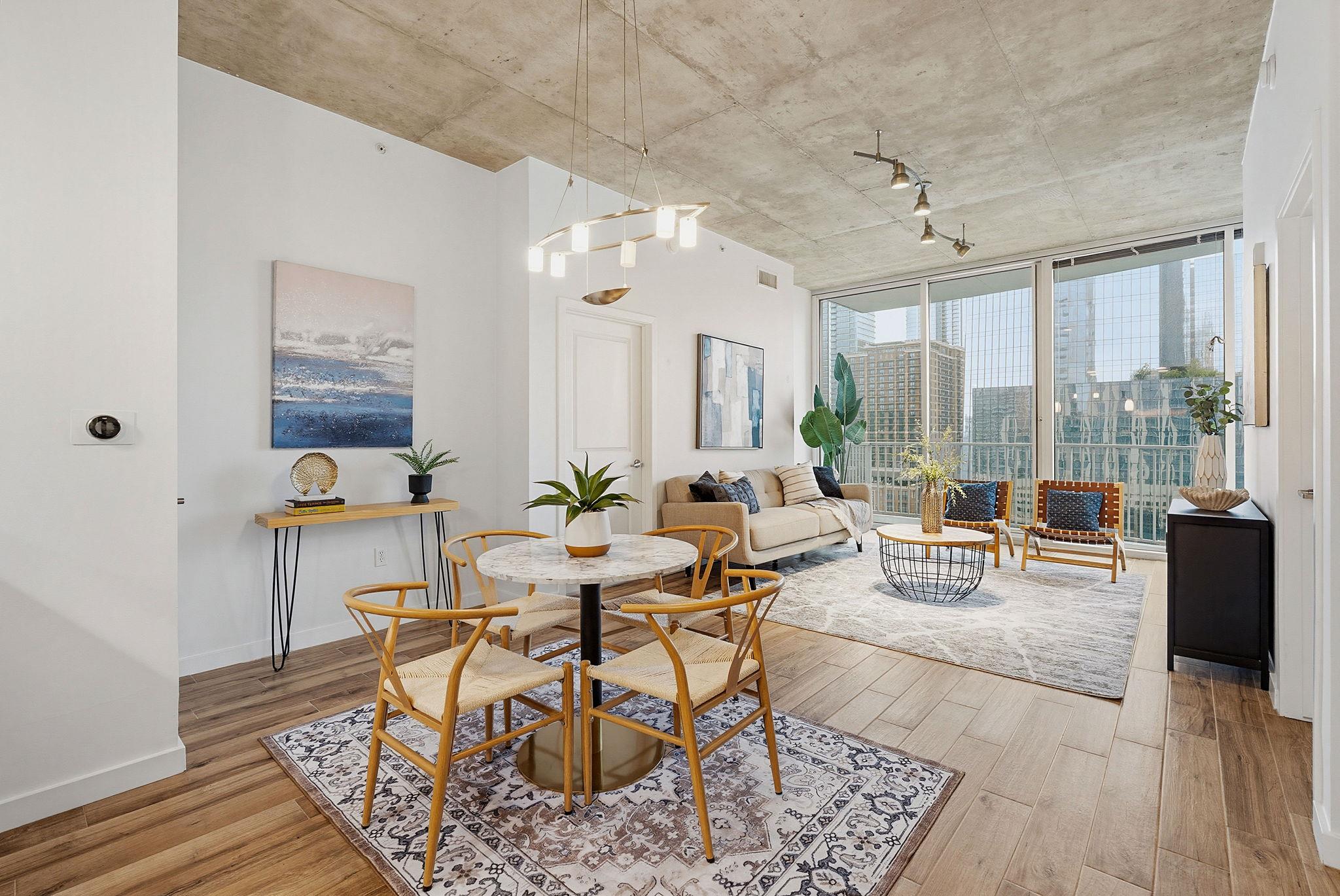 Open-concept living space featuring wood-finish f