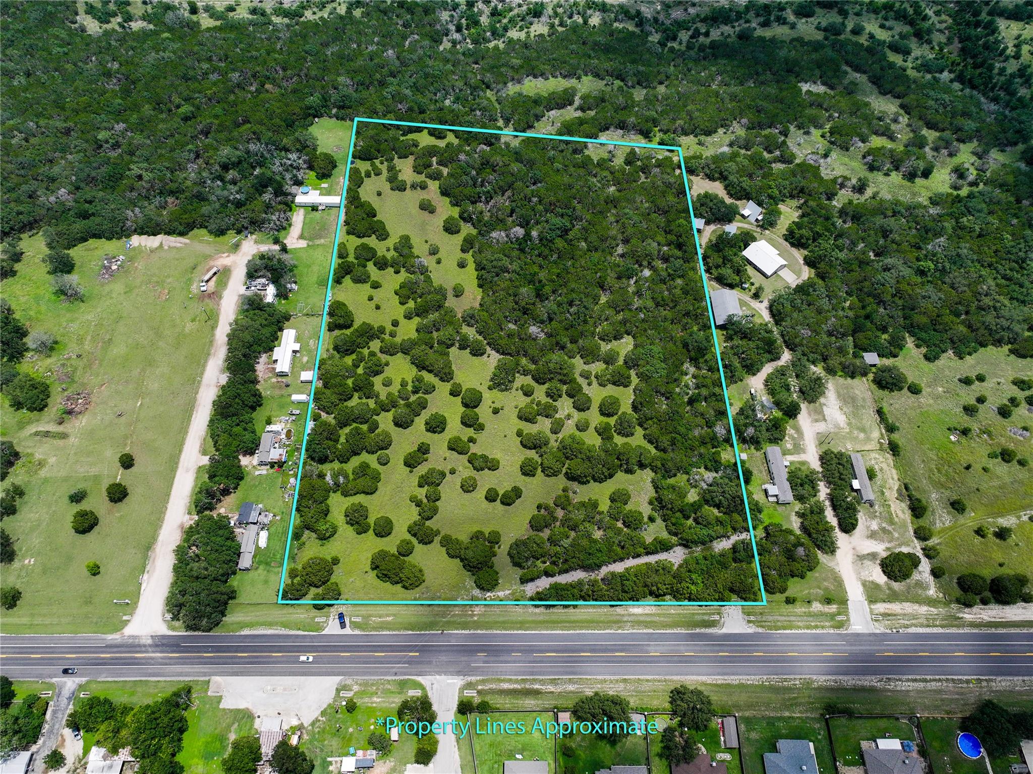 Aerial view of property and surrounding area with