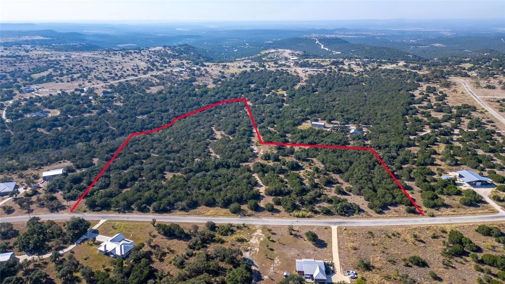 Aerial view of property and surrounding area with
