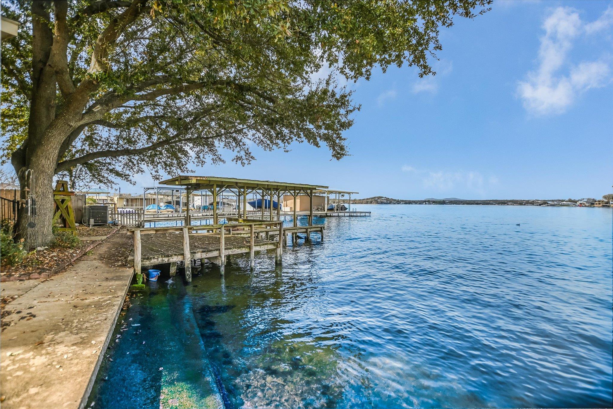 Dock featuring a water view and boat lift