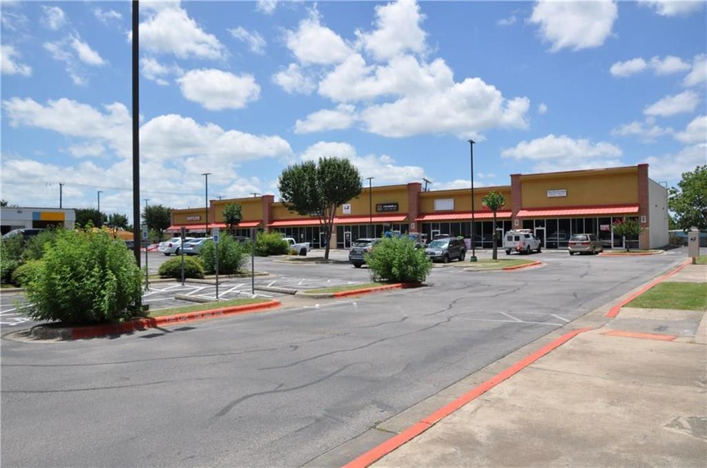 View of asphalt street with curbs and sidewalks