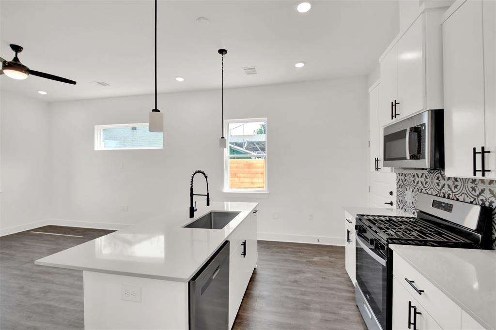 Kitchen featuring stainless steel appliances, whi