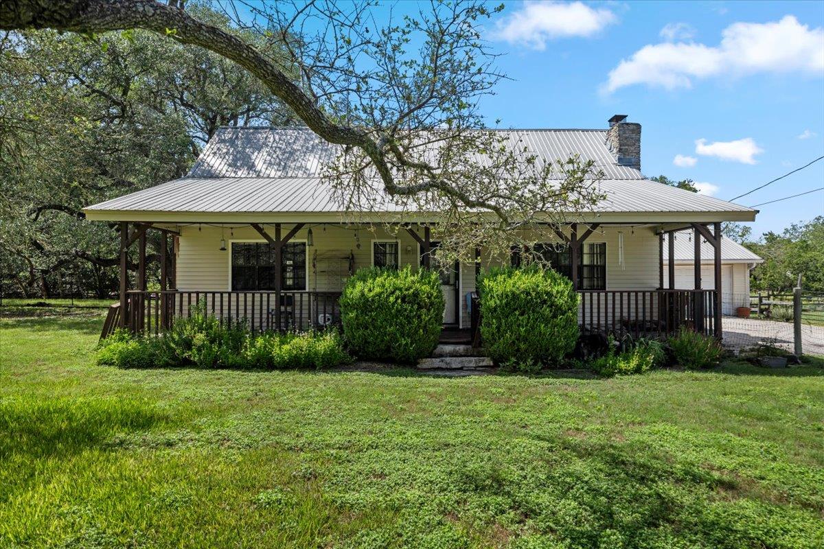 A charming country dwelling with a metal roof and