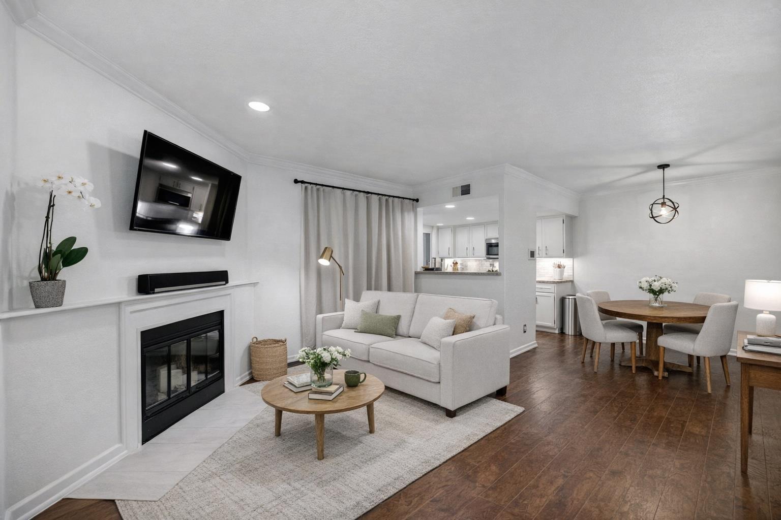 Living room with crown molding, recessed lighting