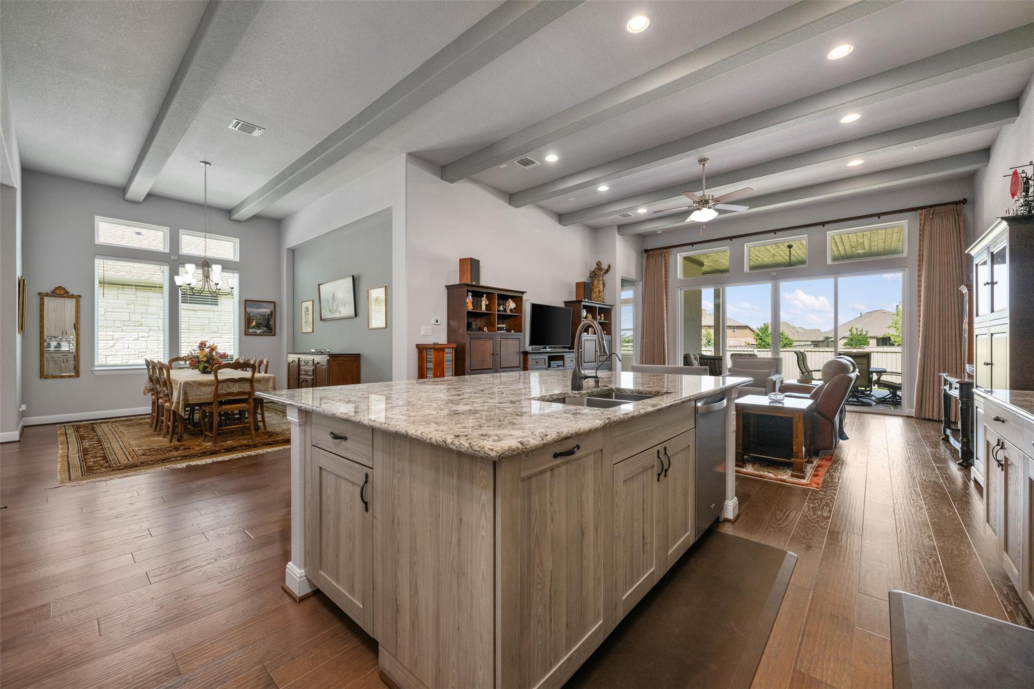 Kitchen featuring open floor plan, light stone co