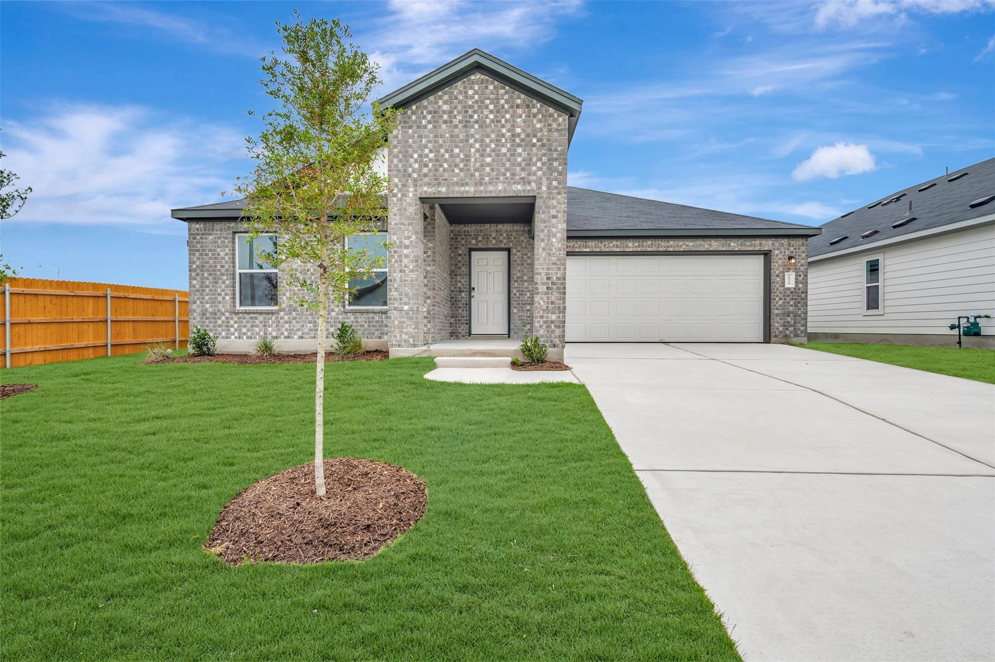 Contemporary brick exterior with a prominent entr
