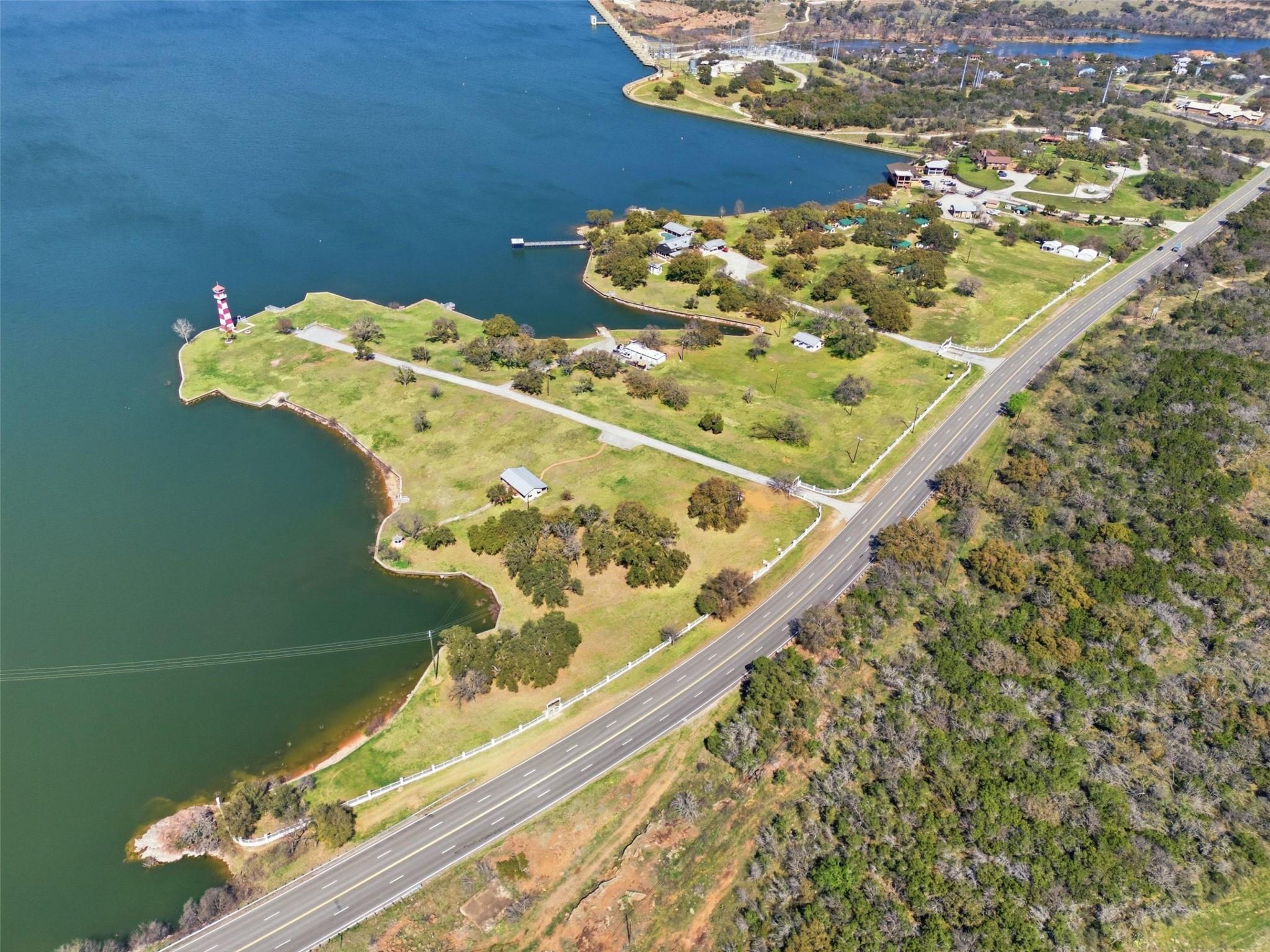 View of property location with a nearby body of w