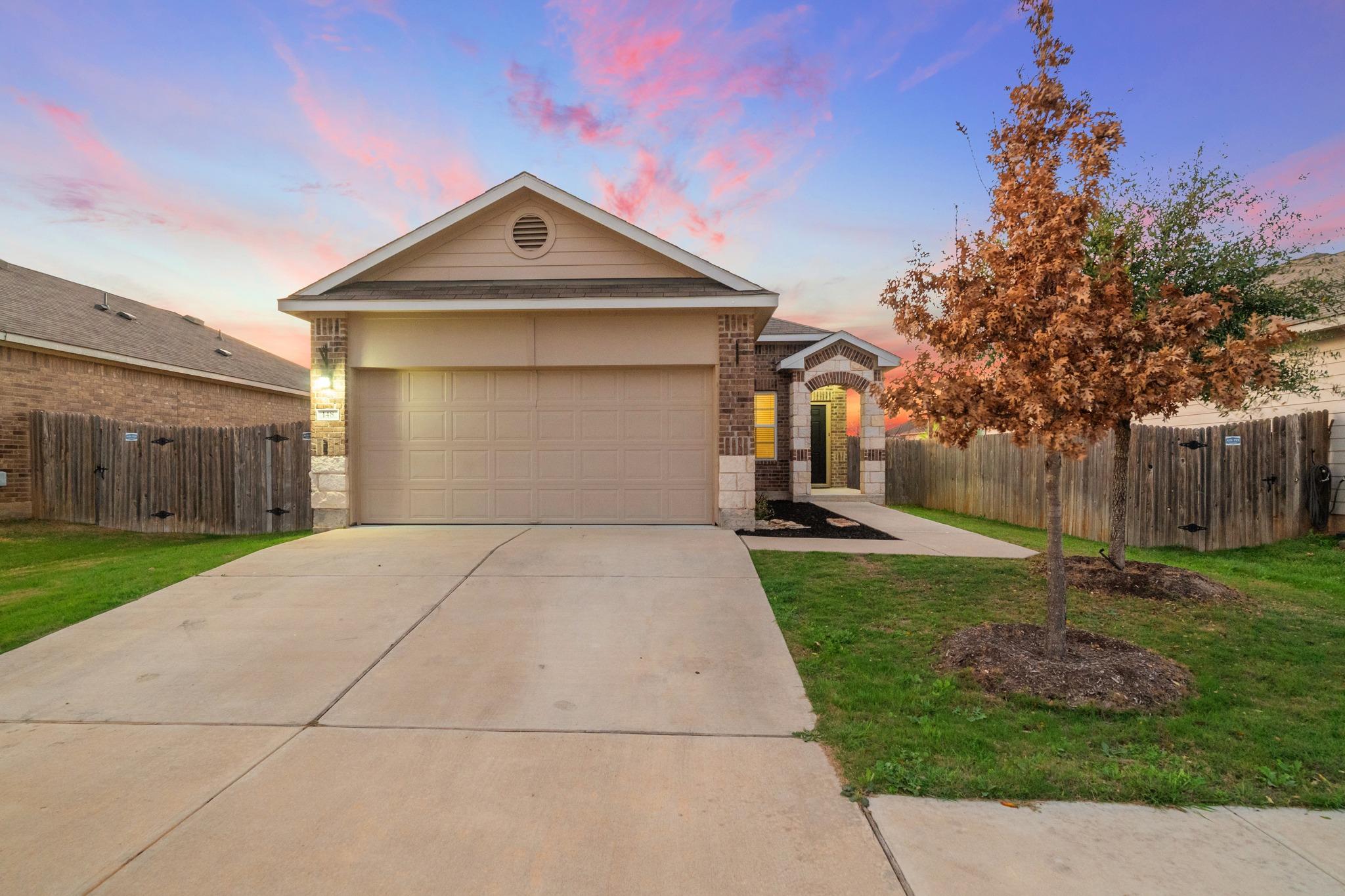 View of front of house with driveway, an attached