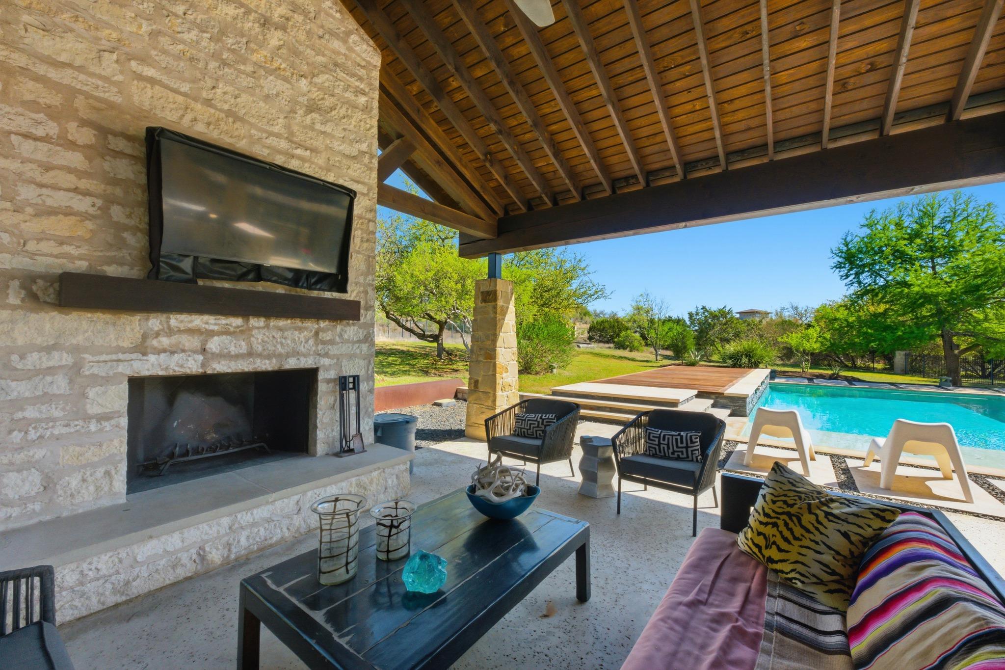 View of patio with an outdoor pool and an outdoor