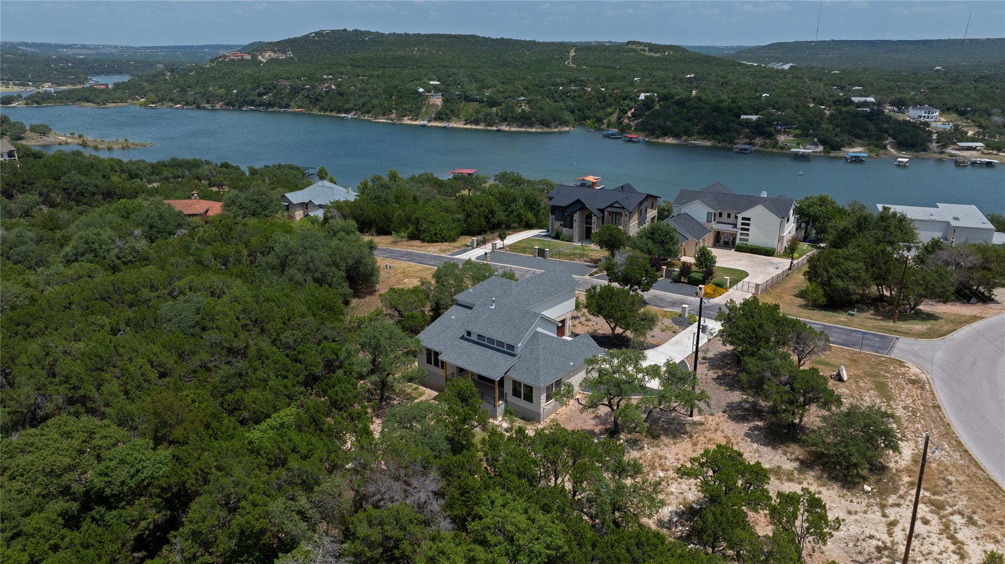 Aerial view reveals a verdant landscape with a ho
