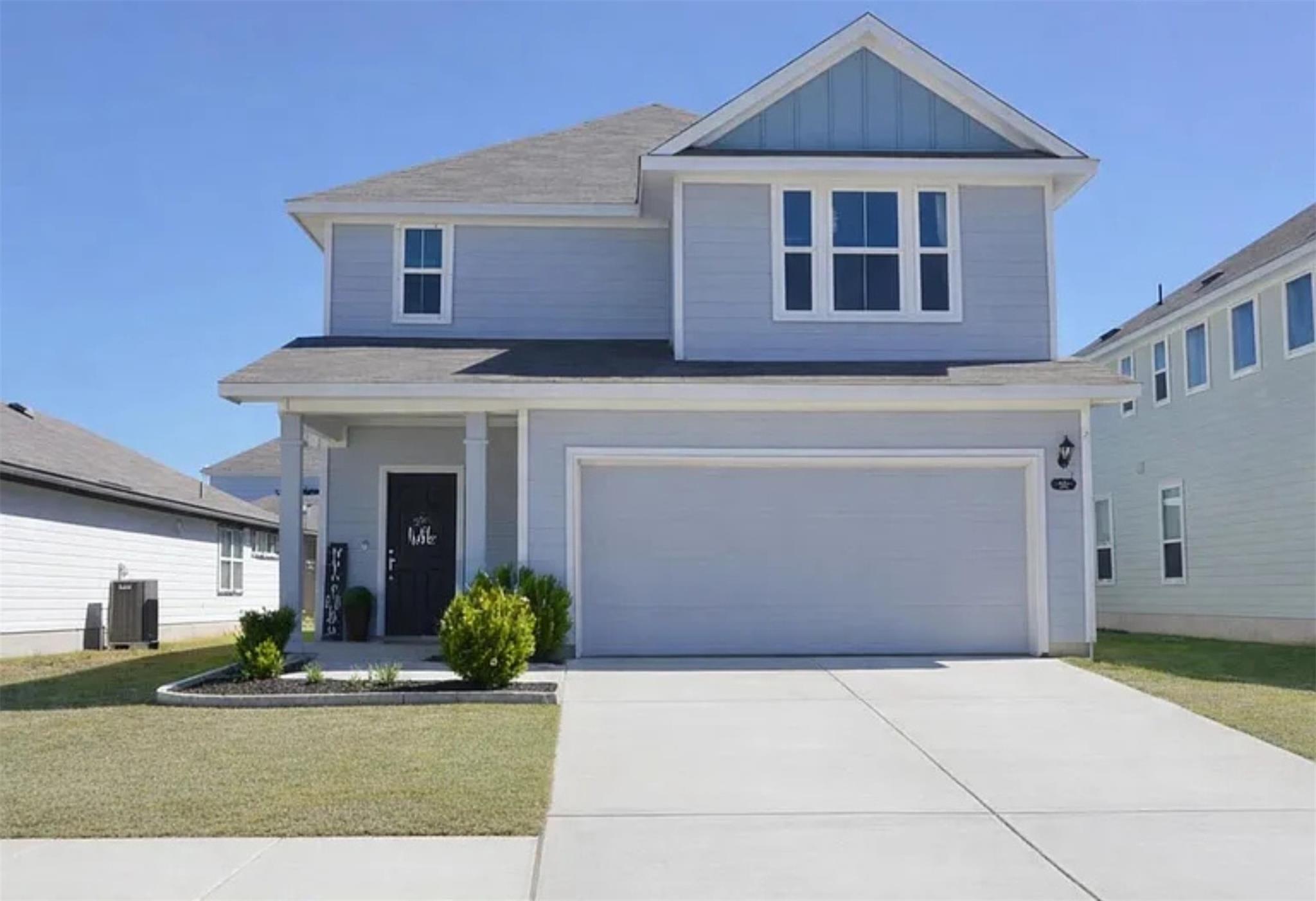 Clean lines and a spacious driveway define this m