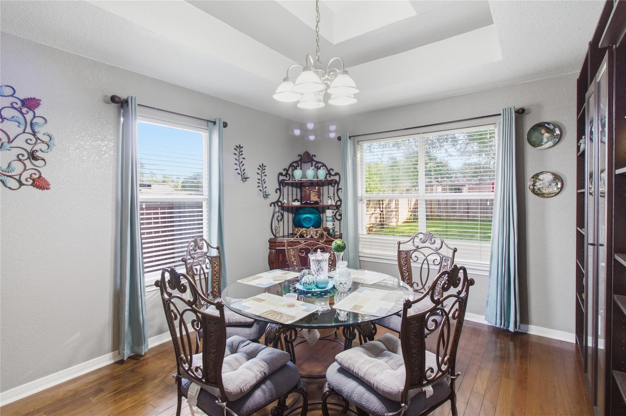 Hardwood floors and a sophisticated chandelier de