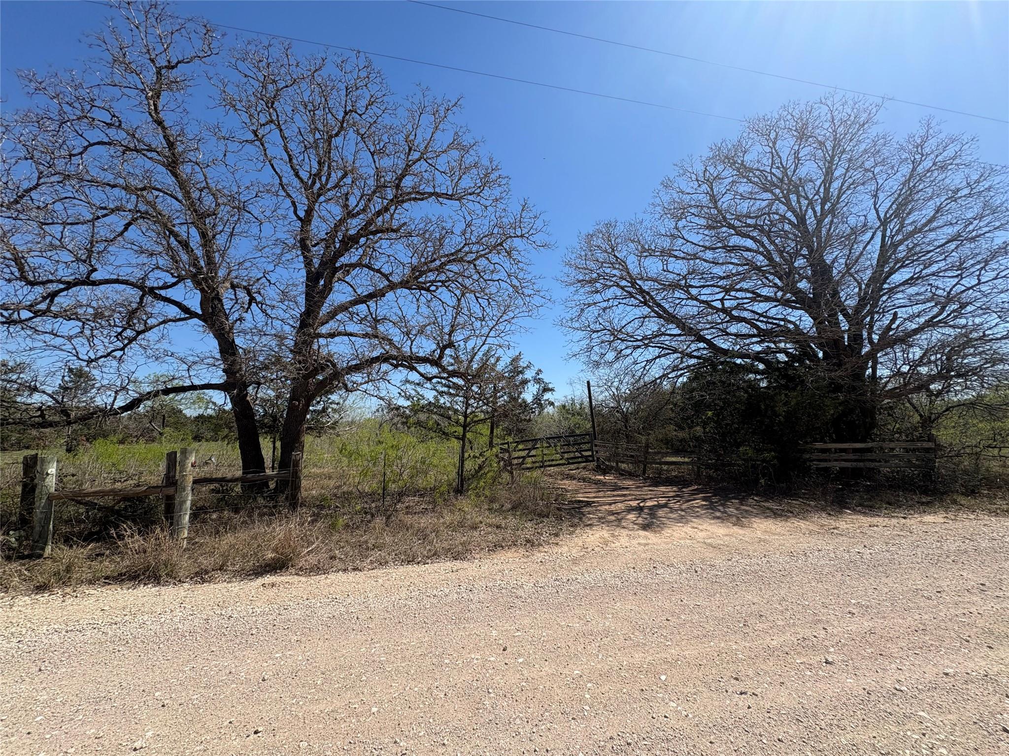 View of dirt / gravel road featuring a view of co