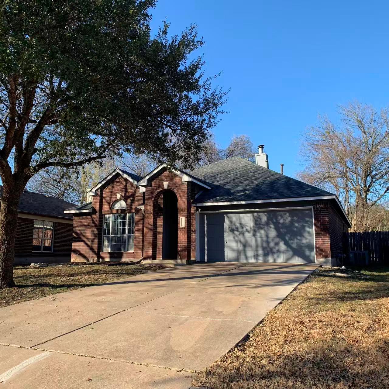View of front of house with an attached garage, c
