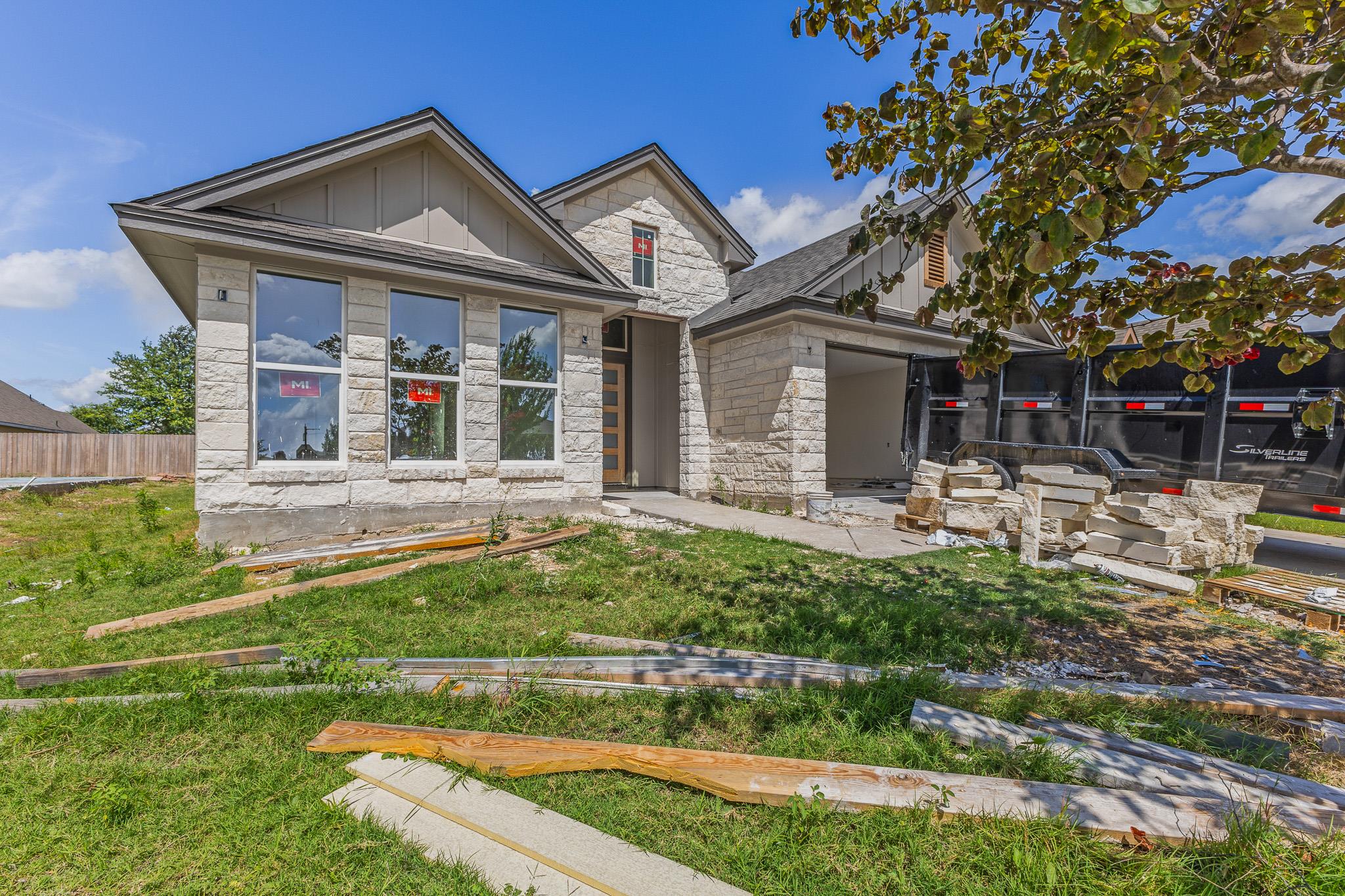 A newly constructed stone and siding residence wi
