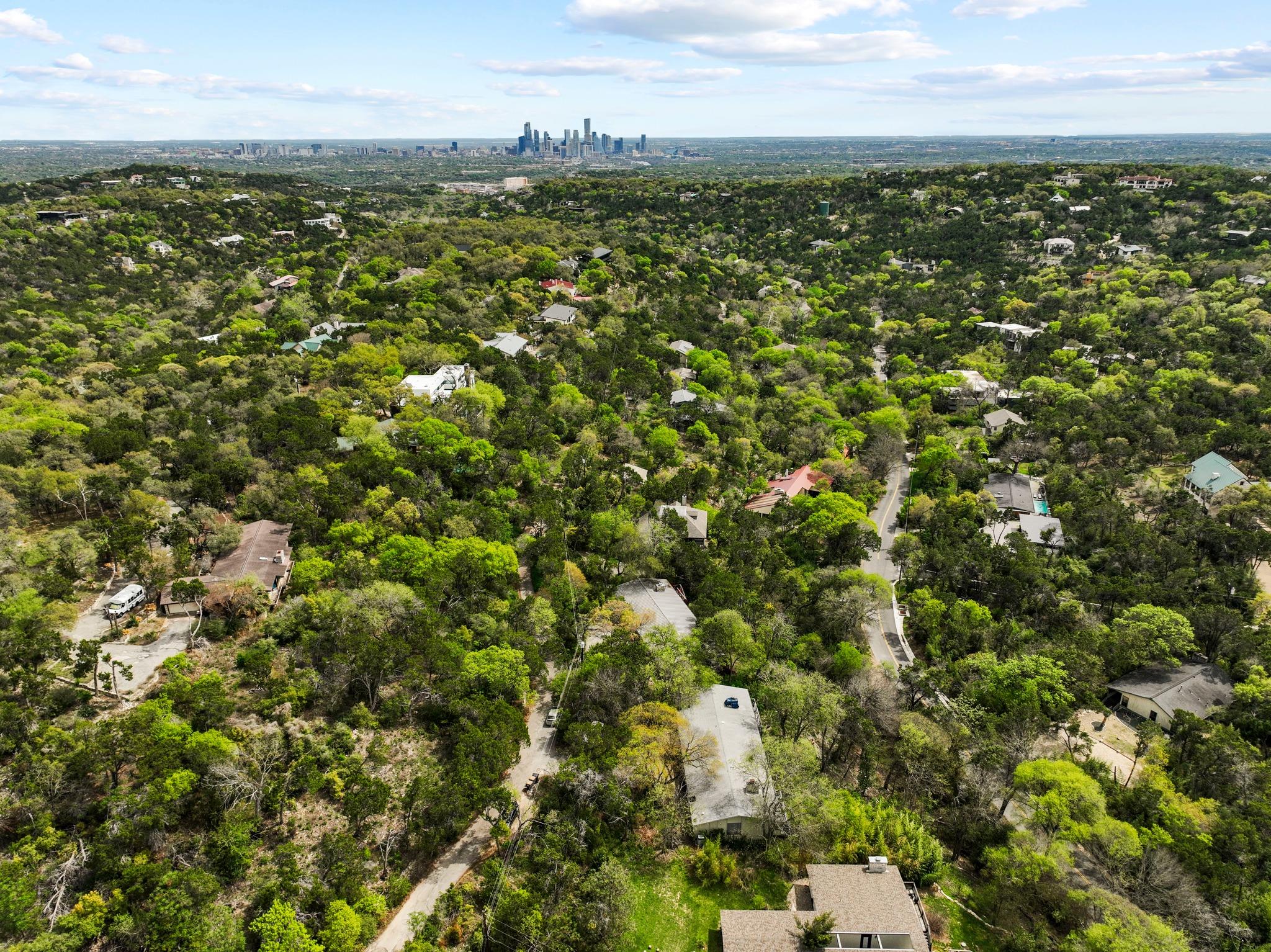 Aerial view of residential area featuring city sk
