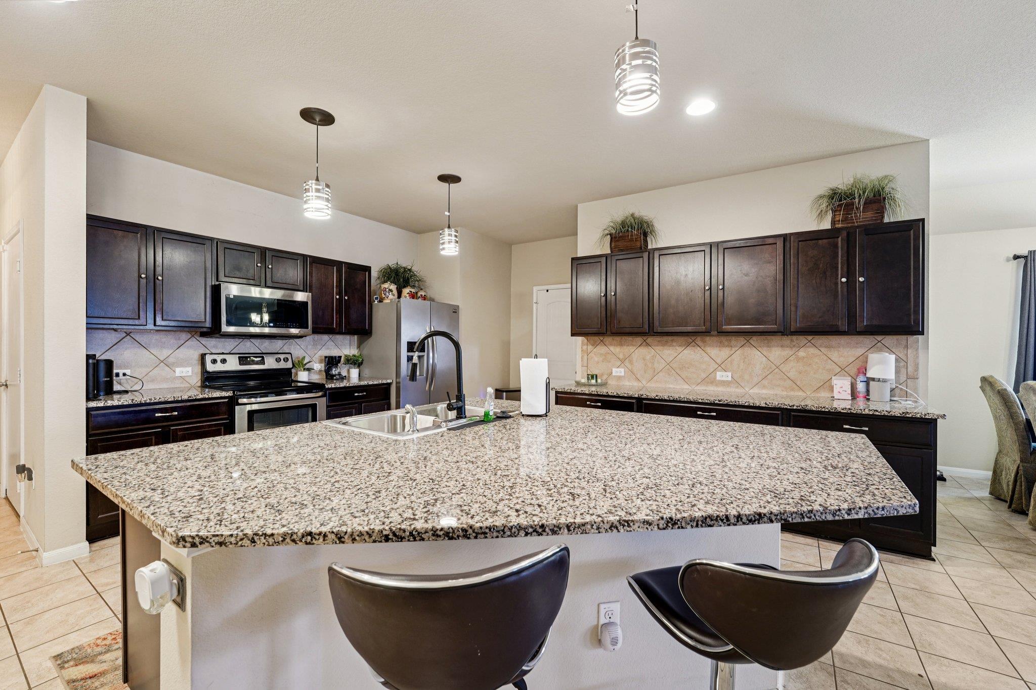 Kitchen featuring light tile patterned flooring, 