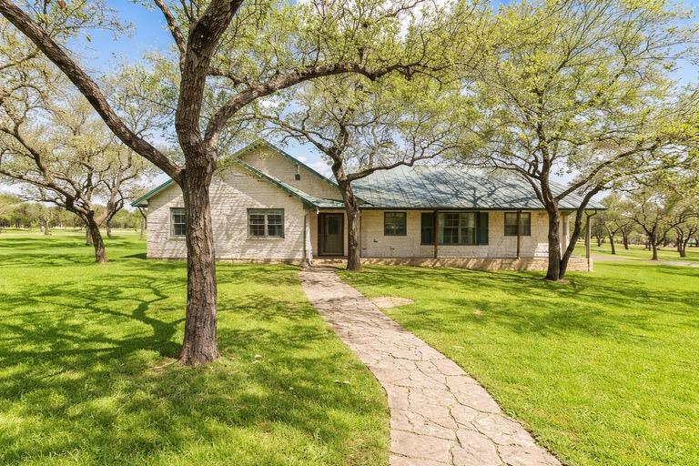 View of front of house with a front yard