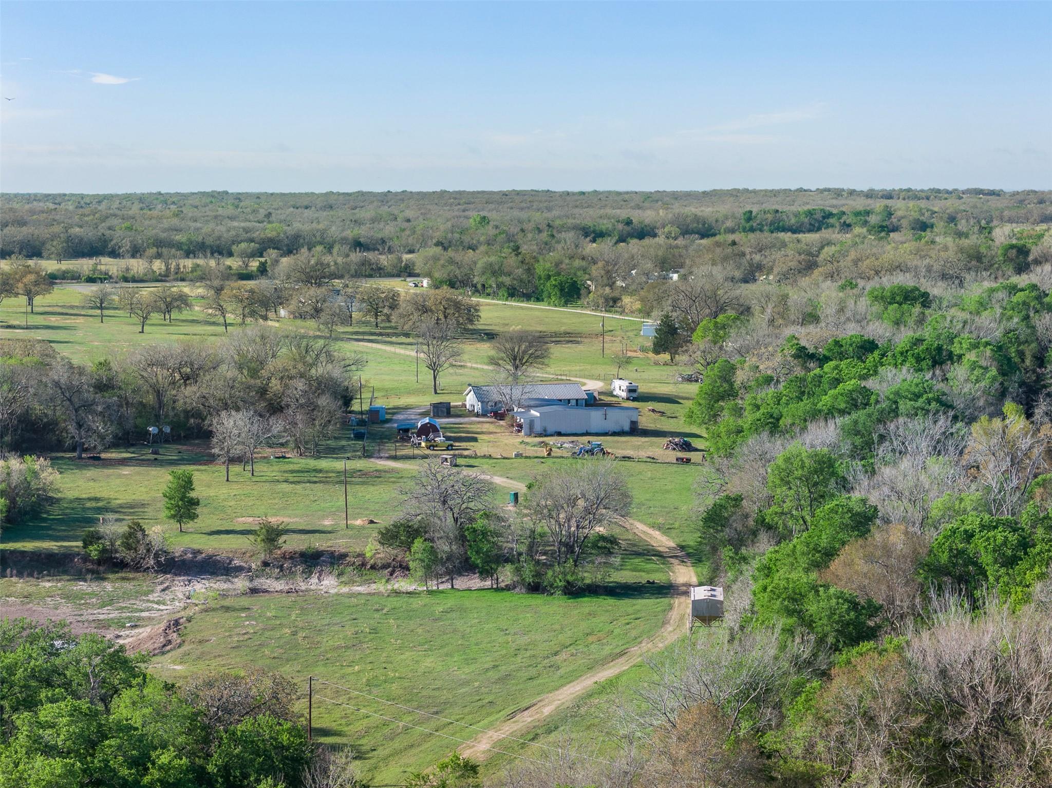 Expansive property featuring a mix of open grassy