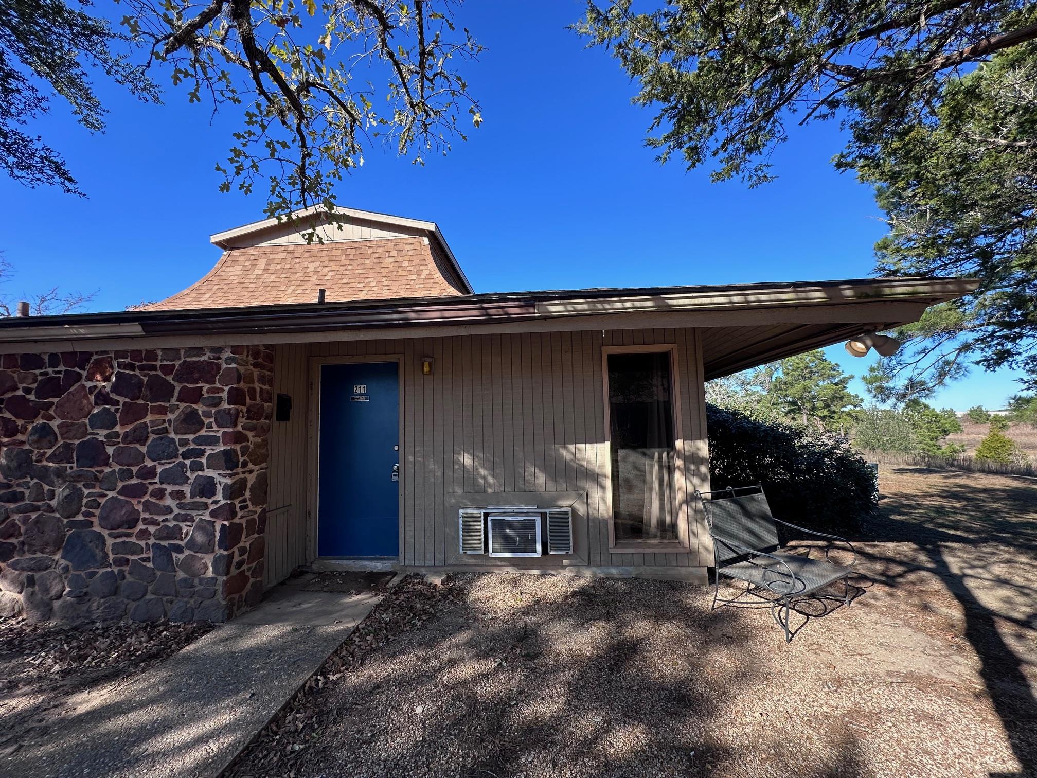 View of exterior entry featuring stone siding
