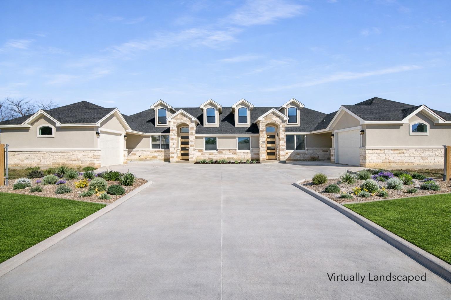 View of front of home with stone siding, concrete