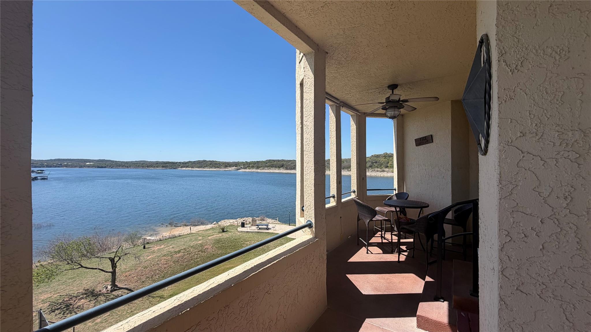 Balcony featuring ceiling fan