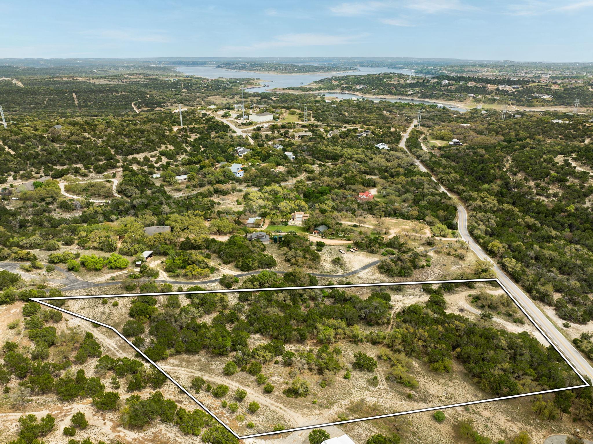 Aerial view of property and surrounding area with