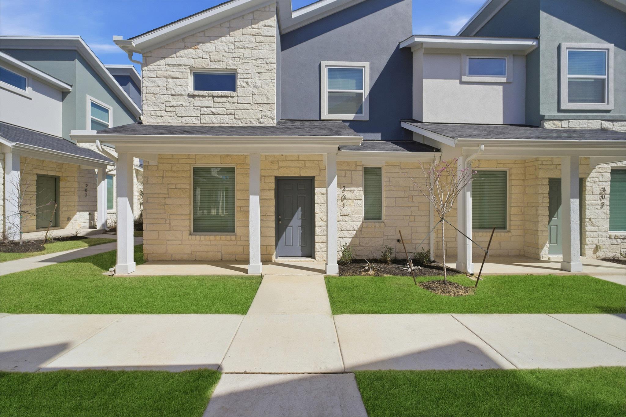 View of front of property featuring stone siding,