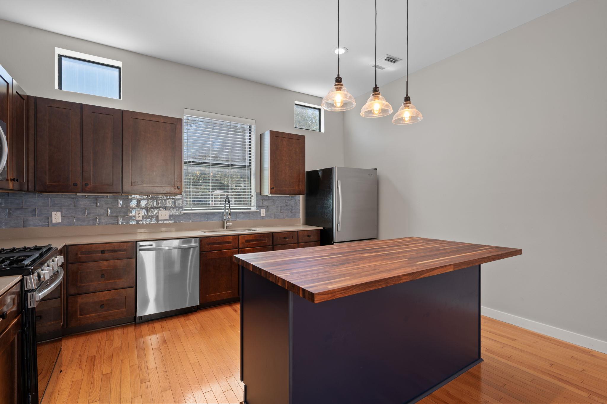 Kitchen with wooden counters, light wood finished