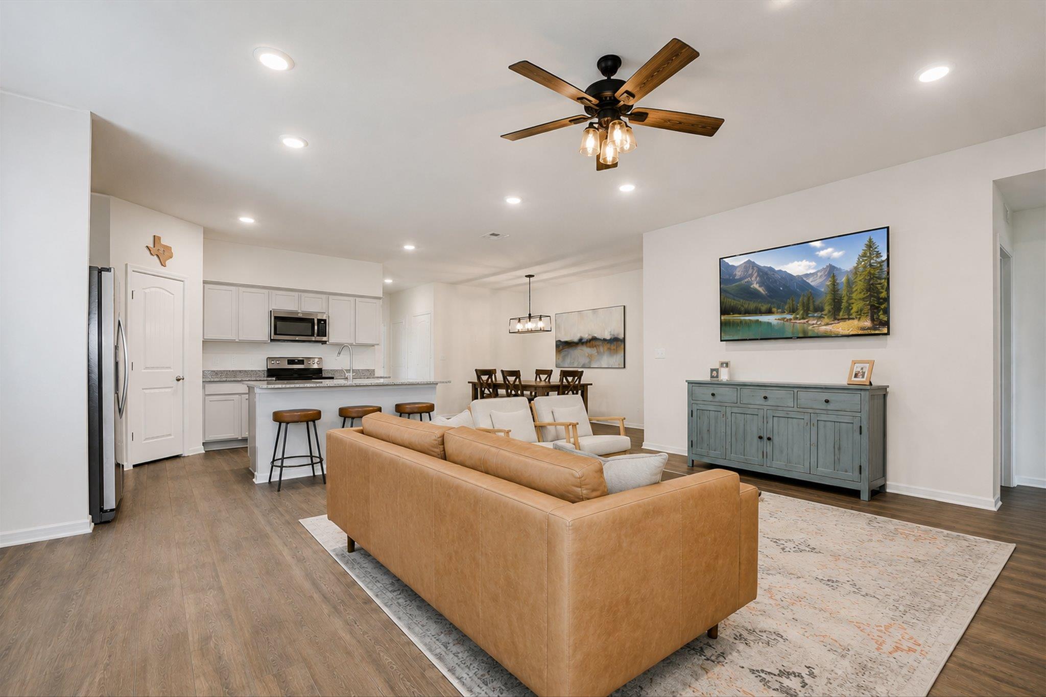 An open-concept layout unites the living, dining,