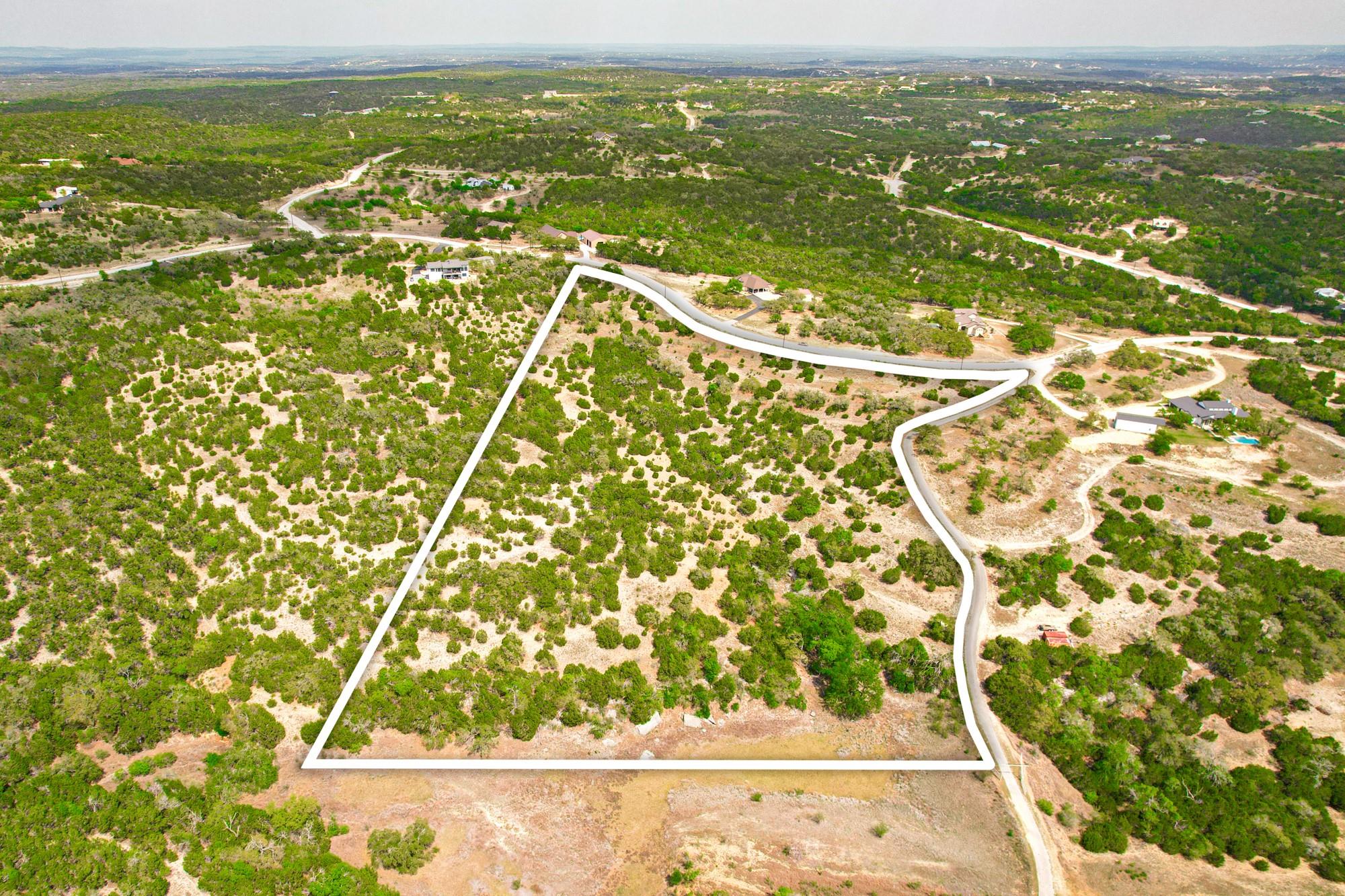 Aerial view of property and surrounding area with