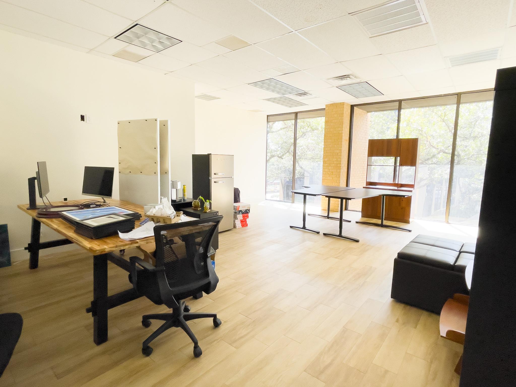 Office area with expansive windows and a paneled 