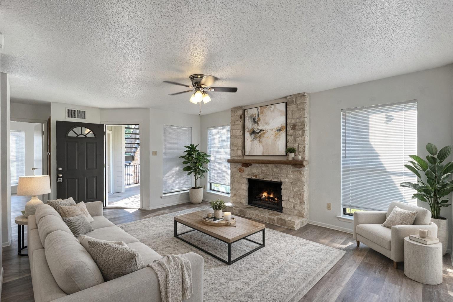 Living area featuring a textured ceiling, a ceili