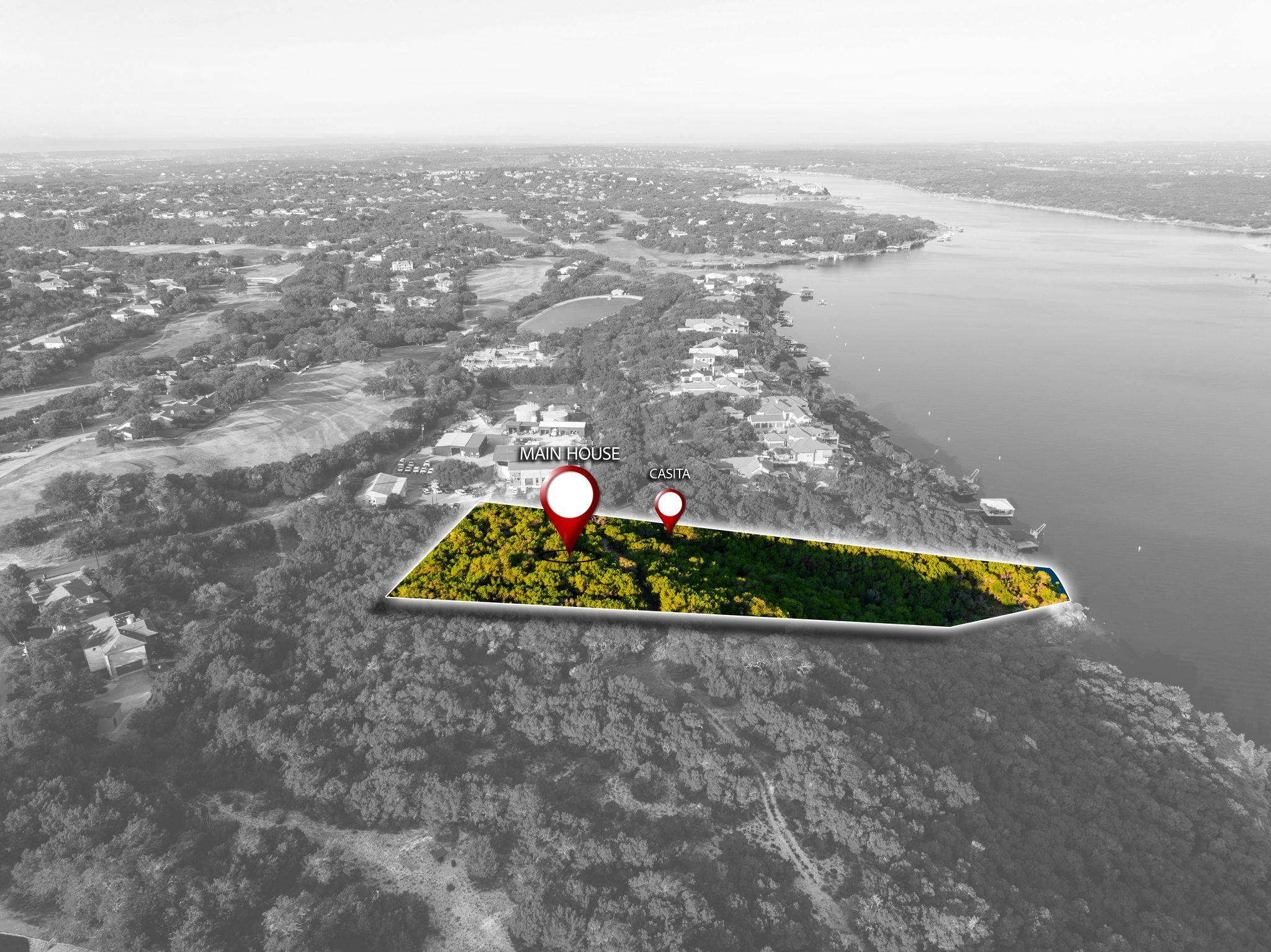 Expansive waterfront parcel featuring a main hous