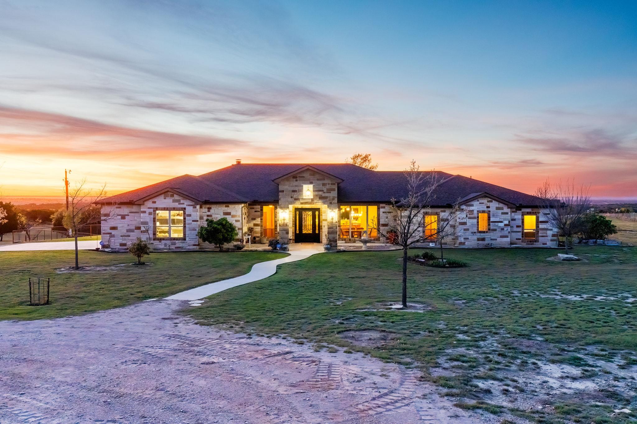 View of front of house featuring stone siding and